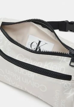 Calvin Klein Jeans STACK LOGO WAISTBAG UNISEX - Sac Banane - Eggshell Stacked Logo Aop -Calvin Klein Elegant Magasin d7389ff47ab54626a0381cb3d0acb234