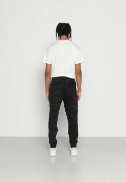 Calvin Klein Jeans LOGO PANT - Pantalon De Survêtement - Black -Calvin Klein Elegant Magasin dca7e23f74ce4cabb47aff248aec03df