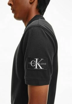 Calvin Klein Jeans BADGE - Polo - Ck Black -Calvin Klein Elegant Magasin e2f40915cb3c49129b4d25e124c1eb84