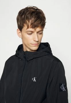 Calvin Klein Jeans UNPADDED HOODED HARRINGTON - Veste Légère - Black -Calvin Klein Elegant Magasin ed774e1ea2304316990bf8227c0de9b6