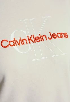 Calvin Klein Jeans TWO TONE MONOGRAM CROP CREW NECK - Sweatshirt - Eggshell -Calvin Klein Elegant Magasin ed7f0f8767d44c83843020446d90dba4