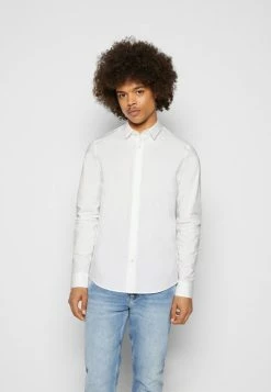 Calvin Klein Jeans CHEST LOGO SLIM STRETCH SHIRT - Chemise - Bright White -Calvin Klein Elegant Magasin f3ab8e6c8e2c491f9baad9556aa40848