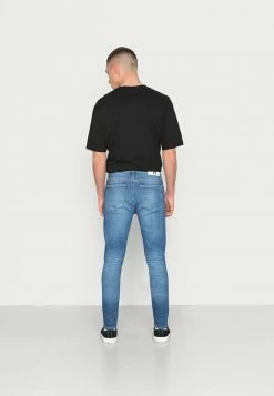 Calvin Klein Jeans SUPER SKINNY - Jeans Skinny - Denim Medium -Calvin Klein Elegant Magasin f75a51acea164f4d98a0483572651ee0