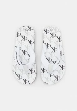 Calvin Klein Jeans UNISEX - Tongs - White 9 Calvin Klein Jeans UNISEX - Tongs - White -Calvin Klein Elegant Magasin f7e74c886a9a40b880ac1ea6f8113a0a