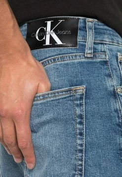 Calvin Klein Jeans SLIM TAPER - Jeans Fuselé - Denim Medium -Calvin Klein Elegant Magasin fc4e6d38d52e4b738163ecbf4eed74b1