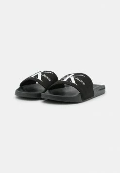Calvin Klein Jeans SLIDE MONOGRAM - Mules - Black 8 Calvin Klein Jeans SLIDE MONOGRAM - Mules - Black -Calvin Klein Elegant Magasin fcef5ef4a0c1476da3ba6bd1298af4a1