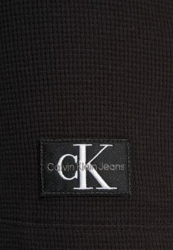 Calvin Klein Jeans BADGE HENLEY DRESS - Robe En Jersey - Black -Calvin Klein Elegant Magasin fd71fc8c31bd4544be9ec6b239fb4746