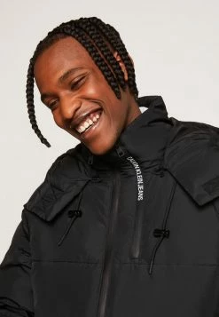 Calvin Klein Jeans BLOCKING HOODED PUFFER - Veste D'hiver - Black -Calvin Klein Elegant Magasin ff80c34e7bcb4317a38c05ccdc68e312